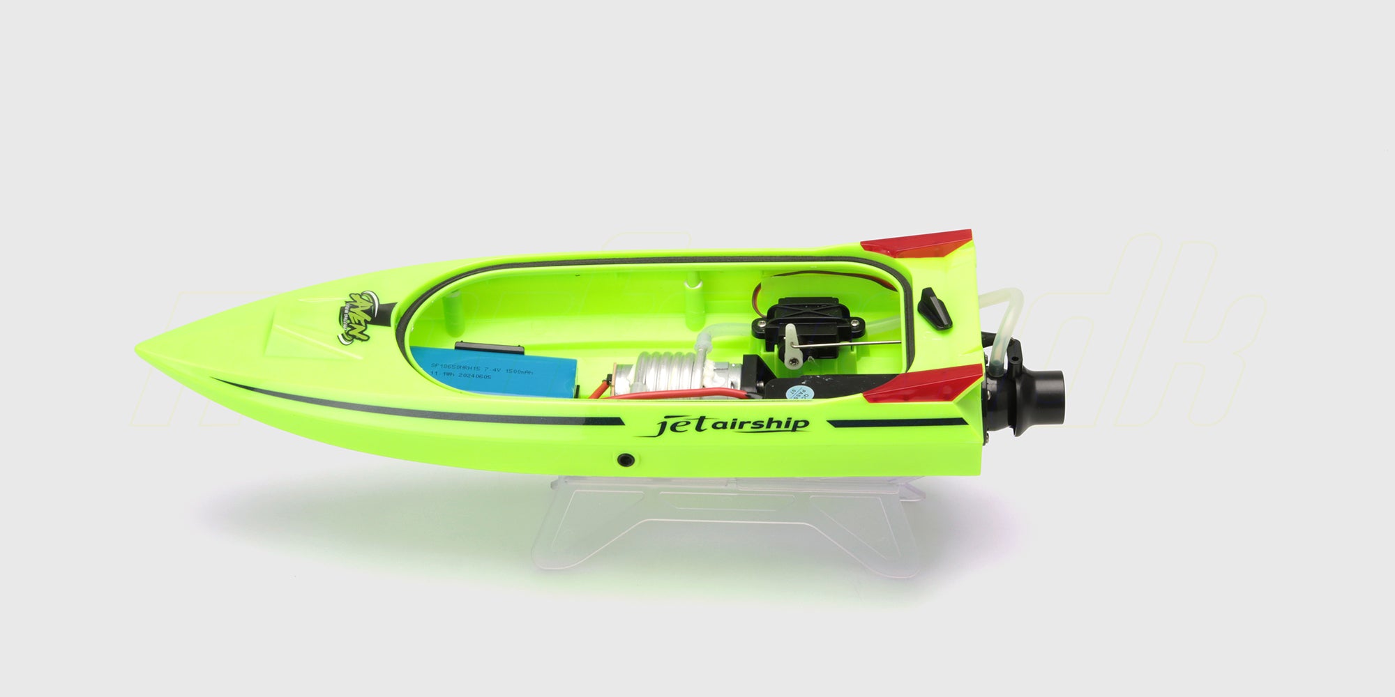 Hvid Storm V8 Superboat fjernstyret racerbåd i fuld fart hen over vandet med store bølgesprøjt bagfra.