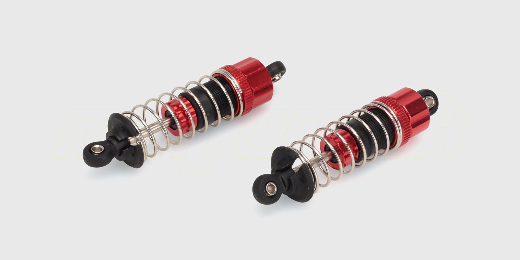 To røde MJX HyperGo metalstøddæmpere med olie til affjedring på en fjernstyret bil.