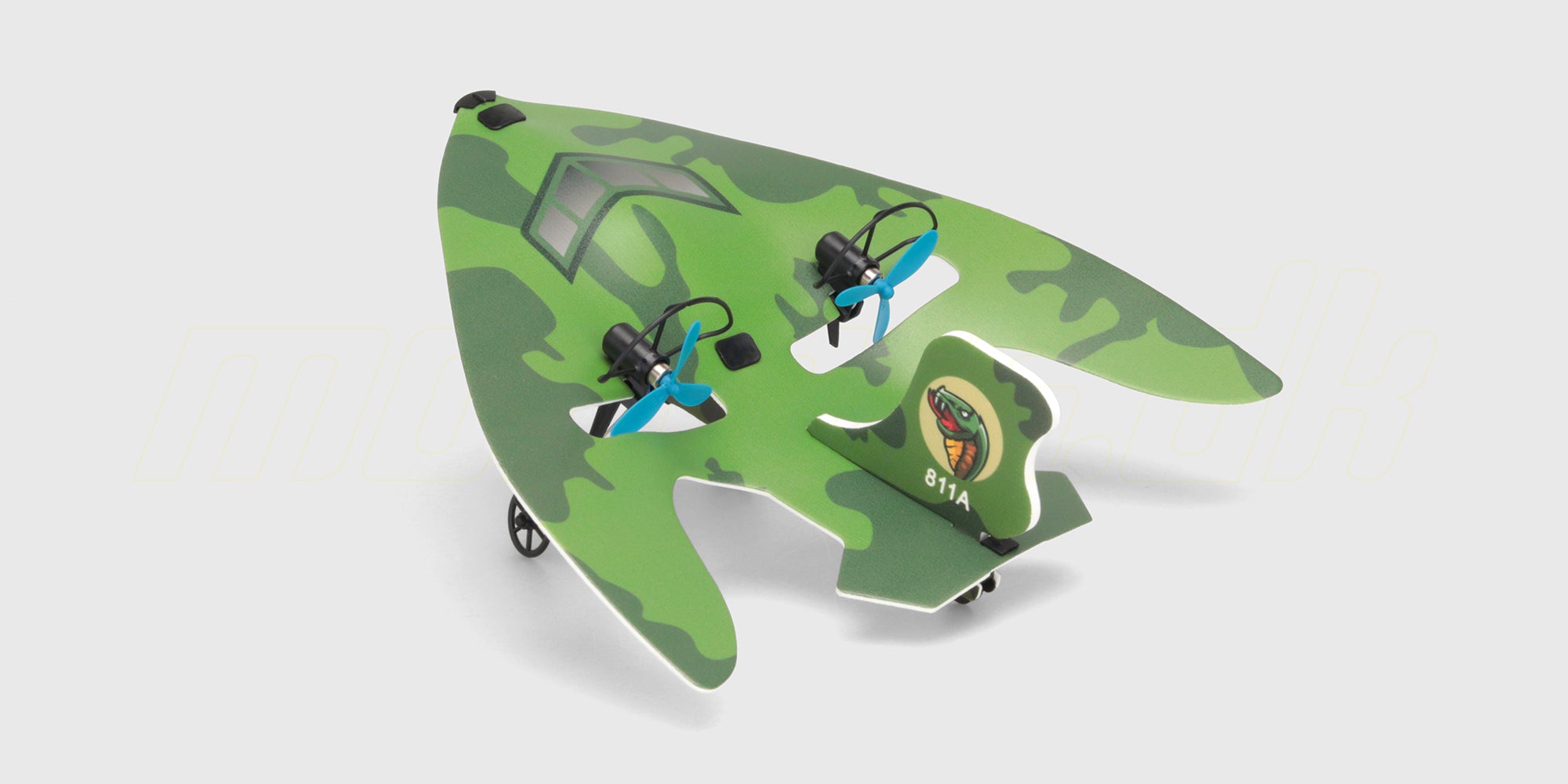 Hvid og blå Mini Glider kasteflyver i flamingo vist skråt fra siden på en hvid baggrund.