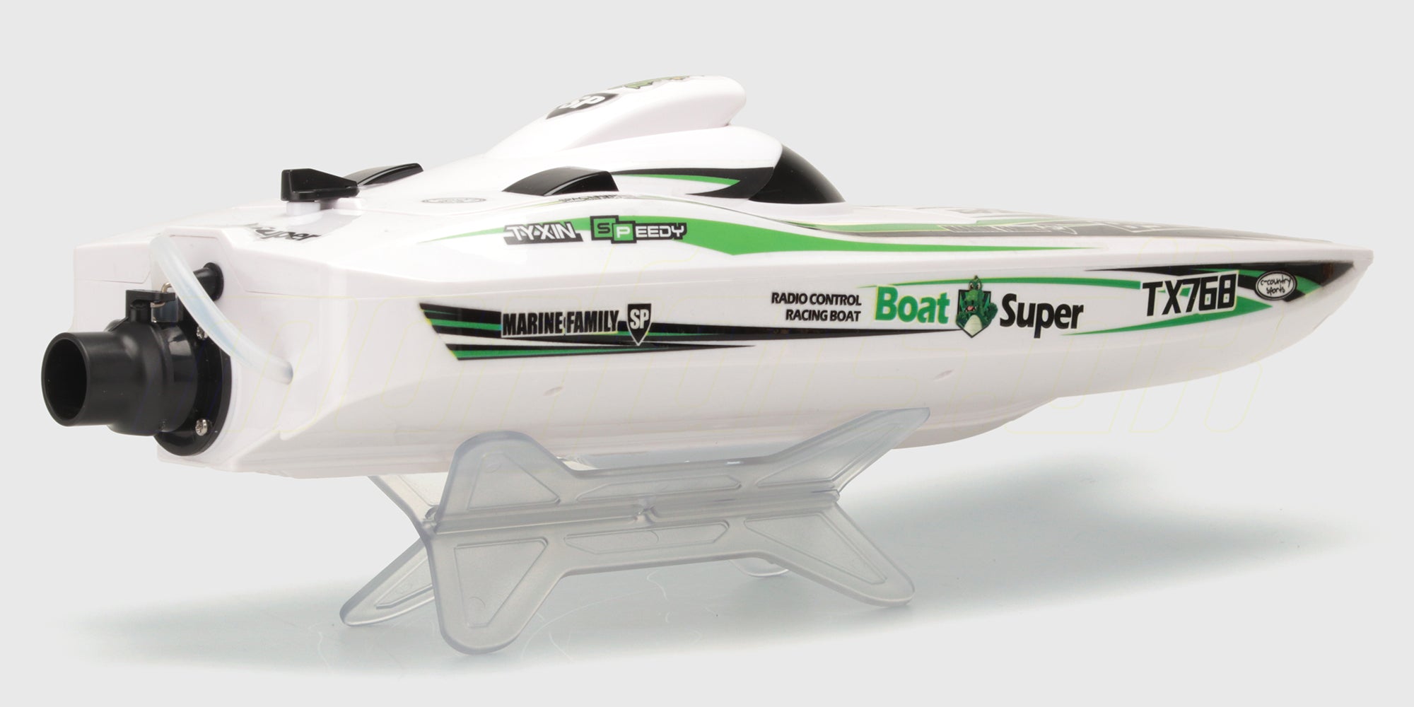 Grøn Super Dino Brushless racingbåd i fuld fart hen over vandet med realistisk vandsprøjt bagfra.