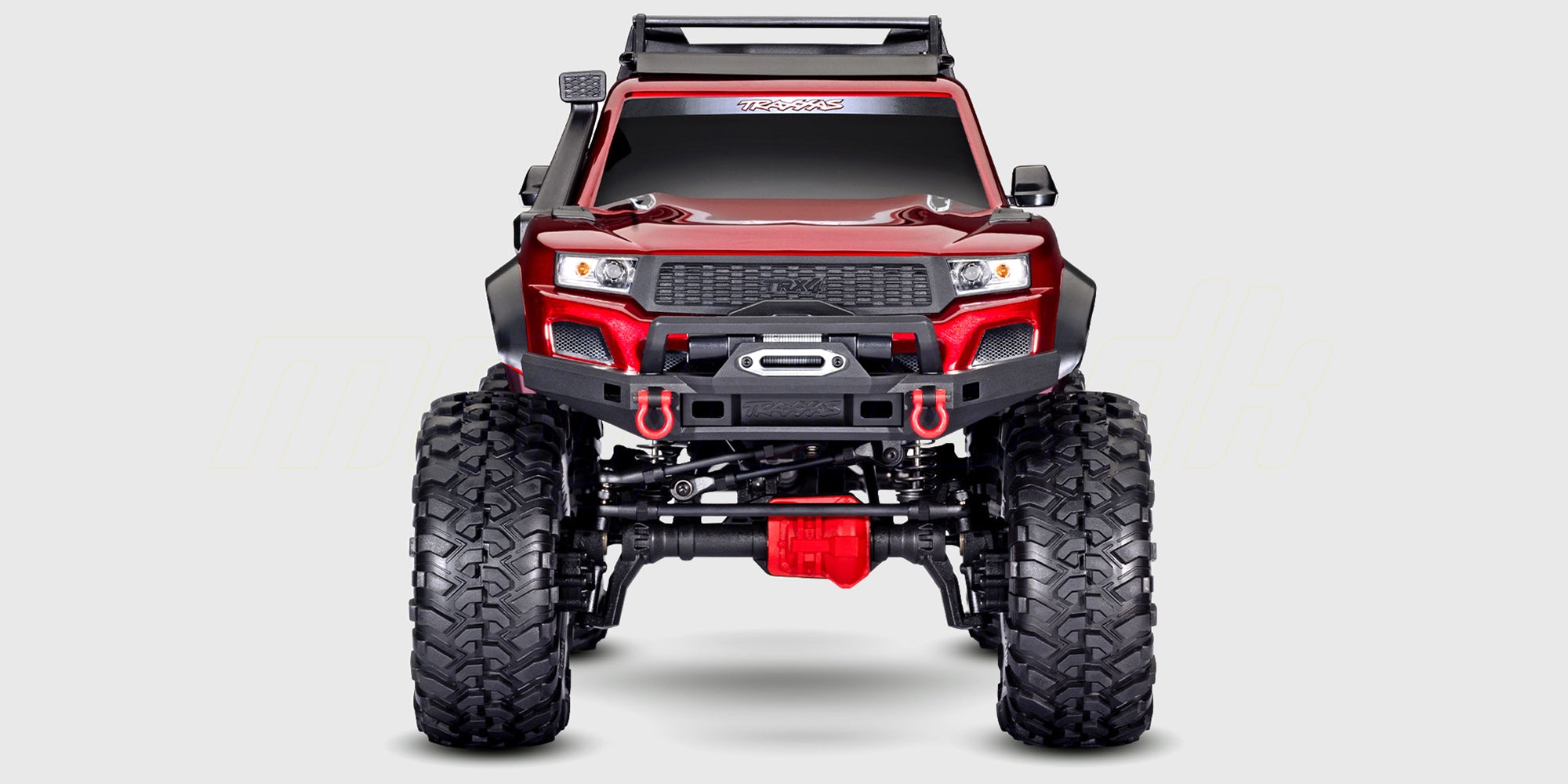 Traxxas TRX-4 Sport High Trail fjernstyret crawler med høj frihøjde klatrer over klipper i råt terræn.
